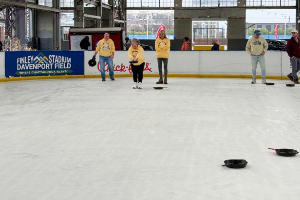 Team members from EvacuationPlans.com participating in the Skillet Curling fundraiser to benefit the Chattanooga Area Food Bank.